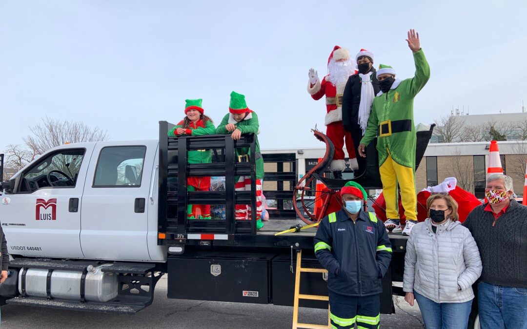 children, Santa, elf, Speaker Jones on back of truck